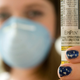 A high school student with severe nut allergies displays an EpiPen and wears a protective mask during an interview in Charleston, West Virginia in 2008.